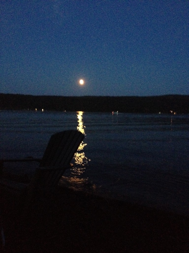 Keuka Lake becomes quiet as the full moon rises and night advances.
