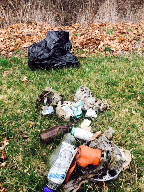 Trash collected includes many types of bottles, plastic and metal.