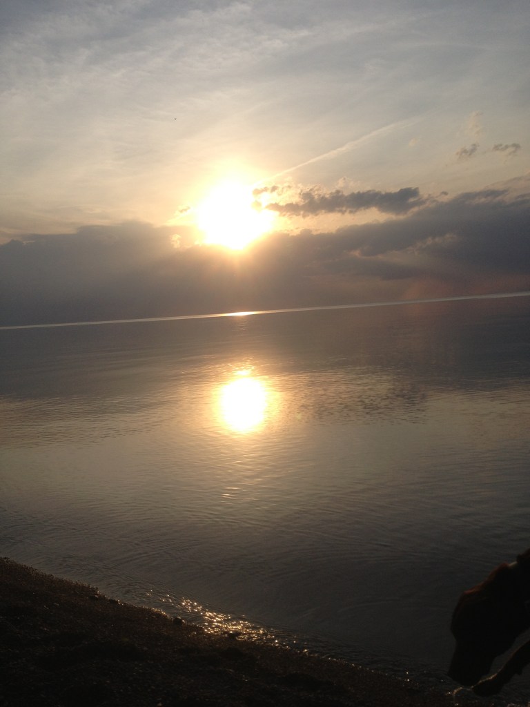 Sun Reflects on Flat Blue Water